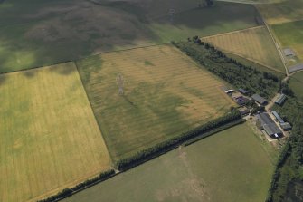 Oblique aerial view centred on the cropmarks of the possible barrow, taken from the NNW.