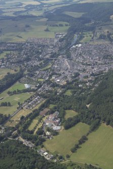 General oblique aerial view of the town with the hotel in the foreground, taken from the ENE.