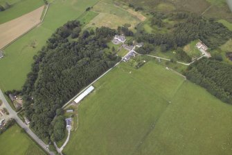 General oblique aerial view centred on the country house, taken from the ENE.