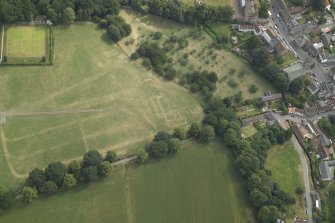 Oblique aerial view centred on the parchmarks (NO 2519 0756) of the marquee and car parking following Big Tent 2006, Scotland's Festival of Stewardship, at Falkland Palace, taken from the WSW.