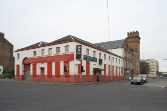 General view from ENE of copper works showing roof line and 7 by 10 bay structure.