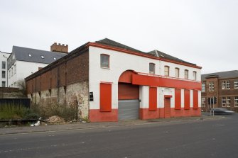 General view from ESE, Tradeston Street elevation showing the 10 by 7 bay brick-built structure, engine house to left (with high doorway)