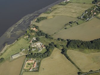 Oblique aerial view centred on the remains of Balmerino Abbey and church and the farmsteading with the remains of the church and burial-ground adjacent, taken from the S.