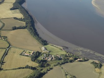 General oblique aerial view centred on the remains of the abbey and church and the farmsteading, taken from the E.