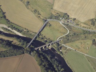 Oblique aerial view centred on the road bridge and the railway viaduct, taken from the ESE.