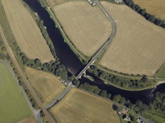 Oblique aerial view centred on the road bridge and the tollhouse, taken from the S.