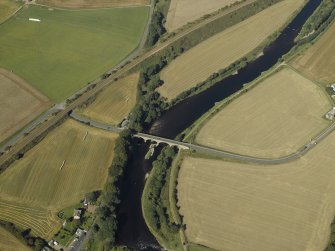 Oblique aerial view centred on the road bridge and the tollhouse, taken from the E.