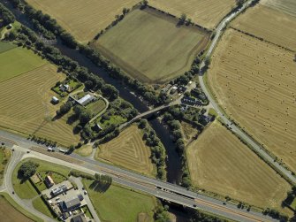 Oblique aerial view centred on the road bridges and tollhouse, taken from the WNW.