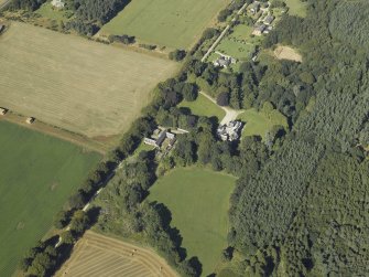 Oblique aerial view centred on the country house, taken from the ESE.