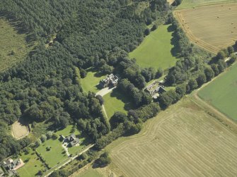 Oblique aerial view centred on the country house, taken from the W.