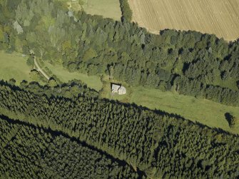 Oblique aerial view centred on the church, taken from the SE.