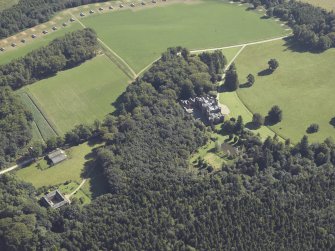 General oblique aerial view centred on the country house and stable, taken from the W.