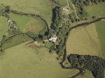 Oblique aerial view centred on the tower-house, taken from the SW.