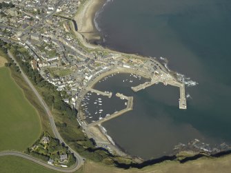 Oblique aerial view centred on the harbour, taken from the S.
