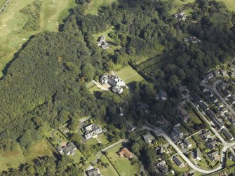 Oblique aerial view centred on the country house, gardens and dovecot with the cottages adjacent, taken from the W.