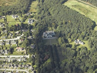 Oblique aerial view centred on the country house, gardens and dovecot with the cottages adjacent, taken from the SSE.