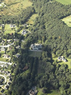 General oblique aerial view centred on the country house, gardens and dovecot with the cottages adjacent, taken from the SE.