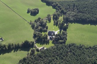 Oblique aerial view centred on the country house, hotel and hall-house, taken from the NE.