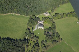 Oblique aerial view centred on the country house, hotel and hall-house, taken from the SW.