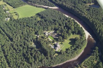 Oblique aerial view centred on the country house, lodge and garden, taken from the WNW.