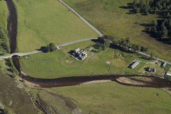 Oblique aerial view centred on the lodge with the road bridge adjacent, taken from the WNW.
