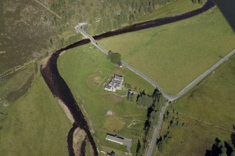 Oblique aerial view centred on the lodge with the road bridge adjacent, taken from the SW.