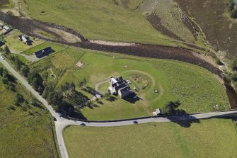 Oblique aerial view centred on the lodge with the road bridge adjacent, taken from the E.