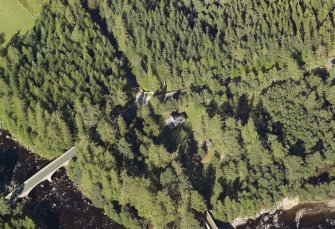 Oblique aerial view centred on the tollhouse and the road bridge, taken from the SW.