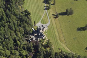 Oblique aerial view centred on the country house, taken from the NW.