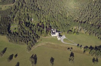 General oblique aerial view centred on the country house with the walled garden adjacent, taken from the SW.