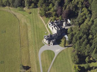 Oblique aerial view centred on the country house, taken from the SE.