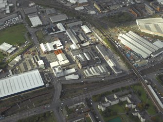 Oblique aerial view centred on the works and warehouses, taken from the SE.