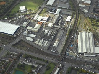 Oblique aerial view centred on the works and warehouses, taken from the E.