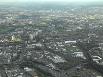 General oblique aerial view of the city with Tradeston in the foreground looking along the route of the proposed M74 extension, taken from the W.