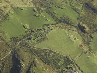 Oblique aerial view centred on the remains of the township, taken from the WNW.