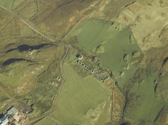 Oblique aerial view centred on the remains of the township, taken from the SW.