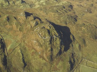 Oblique aerial view centred on the remains of the fort, taken from the ESE.