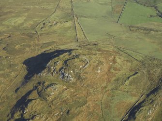 Oblique aerial view centred on the remains of the fort, taken from the SW.