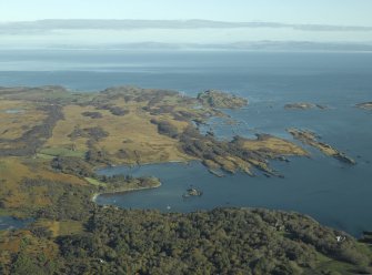 General oblique aerial view looking towards Loch a' Chnuic and Ardilistry Bay with the country house and houses in the foreground, taken from the SW.