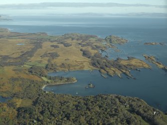 General oblique aerial view looking towards Loch a' Chnuic and Ardilistry Bay with the country house and houses in the foreground, taken from the SW.