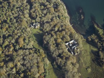 Oblique aerial view centred on the country house and house, taken from the SW.