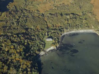 Oblique aerial view centred on the house, taken from the SE.