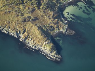 Oblique aerial view centred on the remains of the fort, taken from the E.