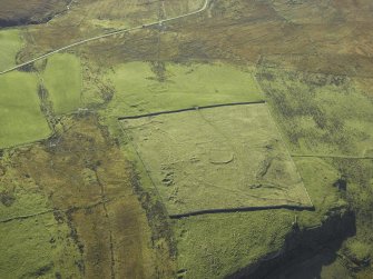 Oblique aerial view centred on the remains of the township, taken from the N.