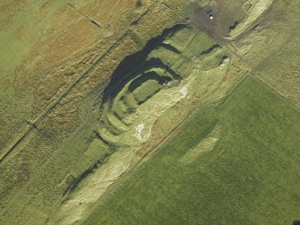 Oblique aerial view centred on the remains of the fort and the township, taken from the SW.