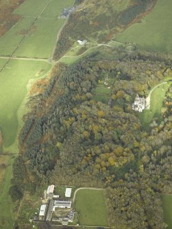 General oblique aerial view centred on the country house and walled garden with the farmsteading and farmhouse and remains of the church and burial-ground adjacent, taken from the SSW.