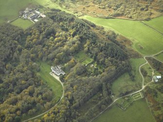 General oblique aerial view centred on the country house and walled garden with the farmsteading and farmhouse and remains of the church and burial-ground adjacent, taken from the NE.