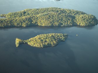 General oblique aerial view centred on the remains of the crannog and the islands, taken from the SE. Clairinsh, Loch Lomond.