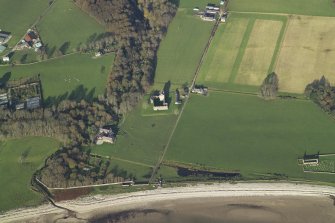 General oblique aerial view centred on the remains of the tower-house with the country house and remains of the church and burial ground adjacent, taken from the SW.