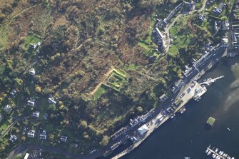 Oblique aerial view centred on the remains of the castle, taken from the NE.